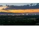 A breathtaking sunset over the Las Vegas skyline, showcasing the city's vibrant lights and surrounding mountains at 515 Serenity Point Dr, Henderson, NV 89012