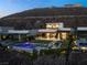 Beautiful modern house featuring an in-ground pool, patio, and stunning outdoor living area at 515 Serenity Point Dr, Henderson, NV 89012