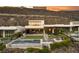 Modern home with a pool, outdoor seating, lush landscaping, and expansive backyard at 515 Serenity Point Dr, Henderson, NV 89012