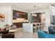 Spacious kitchen featuring a large island, bar seating, custom cabinets, and modern lighting at 515 Serenity Point Dr, Henderson, NV 89012