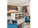 Open concept kitchen with a large marble island, counter seating, and pendant lighting fixtures at 515 Serenity Point Dr, Henderson, NV 89012