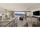 Comfortable upper living room boasts city views, neutral tones, textured wallpaper, and contemporary furnishings at 515 Serenity Point Dr, Henderson, NV 89012