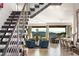 Bright and airy living area featuring a modern staircase and open floor plan at 515 Serenity Point Dr, Henderson, NV 89012