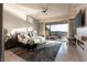 Luxurious main bedroom with a large bed, scenic views, and an outdoor seating area at 515 Serenity Point Dr, Henderson, NV 89012