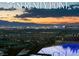 Beautiful pool with a view of the city skyline at sunset at 515 Serenity Point Dr, Henderson, NV 89012