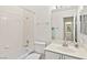 Well-lit bathroom featuring a tub, shower, and a vanity with sink and mirror at 5448 Cove Point Dr, Las Vegas, NV 89130