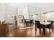 Open dining space featuring wood laminate flooring and large mirror at 5448 Cove Point Dr, Las Vegas, NV 89130