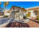 Single Gathering home featuring a desert landscape, a spacious driveway, and two-car garage at 5448 Cove Point Dr, Las Vegas, NV 89130