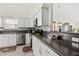 Efficient kitchen featuring white cabinets and granite countertops at 5448 Cove Point Dr, Las Vegas, NV 89130