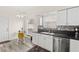 Bright kitchen featuring white cabinets and tile backsplash at 5448 Cove Point Dr, Las Vegas, NV 89130