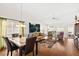 Open-concept living room with high ceilings, hardwood floors, and comfortable seating arrangement at 5448 Cove Point Dr, Las Vegas, NV 89130