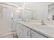 Bright bathroom with double sinks, a large mirror, and a glass-enclosed shower at 5448 Cove Point Dr, Las Vegas, NV 89130