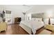 Spacious main bedroom featuring a decorative headboard, desk, and hardwood floors at 5448 Cove Point Dr, Las Vegas, NV 89130