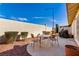 Cozy patio area with outdoor seating, perfect for relaxing and entertaining with a grill at 5448 Cove Point Dr, Las Vegas, NV 89130
