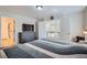 Cozy bedroom with neutral carpet and an adjacent bathroom at 6007 Sonoma Station Ave, Las Vegas, NV 89139