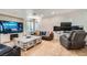 Inviting living room featuring tile floors, a large tv, and modern furniture at 6007 Sonoma Station Ave, Las Vegas, NV 89139