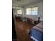 Bright bedroom with wood floors, natural light, sliding closet doors, and neutral decor at 6429 Hill View Ave, Las Vegas, NV 89107