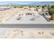 A desert home with a red front door surrounded by desert landscape at 660 Indian Rd, Pahrump, NV 89048