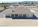 A nice desert home with an open back patio and a well-manicured roof at 660 Indian Rd, Pahrump, NV 89048