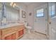 Cozy bathroom featuring a single sink, tile counters, and neutral accents at 660 Indian Rd, Pahrump, NV 89048