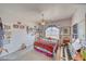Cozy bedroom featuring a large bed, unique decor, and a ceiling fan for added comfort at 660 Indian Rd, Pahrump, NV 89048