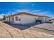 A desert home with an open back patio and two garages at 660 Indian Rd, Pahrump, NV 89048