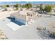 Single-story home showcasing a well-maintained landscape, circular driveway, and mountain views at 660 Indian Rd, Pahrump, NV 89048