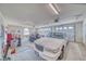 Spacious garage with an open overhead door, storage, and a large white car at 660 Indian Rd, Pahrump, NV 89048