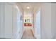 Hallway leading to a bathroom showcasing neutral walls and carpet flooring at 660 Indian Rd, Pahrump, NV 89048