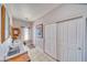 Bright hallway features tile floors, neutral walls, closet doors, and office space at 660 Indian Rd, Pahrump, NV 89048
