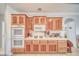 Well-equipped kitchen featuring wood cabinets, modern appliances, and ample counter space at 660 Indian Rd, Pahrump, NV 89048