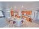 Open concept kitchen with a breakfast bar, island, light wood cabinets, and built-in appliances at 660 Indian Rd, Pahrump, NV 89048