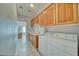 Functional laundry room with ample cabinet space, sink, and modern washer/dryer at 660 Indian Rd, Pahrump, NV 89048