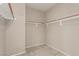 Walk-in closet with carpet flooring and built-in shelving for organized storage at 682 Baffin Island Rd, Henderson, NV 89011