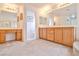 Large main bathroom with and sinks and vanities, mirrors and carpeted floor at 694 Tomscott Ave, Henderson, NV 89052