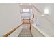 View of staircase leading into the living area showcasing a large window and neutral tones at 694 Tomscott Ave, Henderson, NV 89052