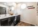 This bathroom features a double sink, round windows and nice tile flooring at 795 Pickled Pepper Pl, Henderson, NV 89011