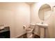 This half bath features a pedestal sink and tile floors at 795 Pickled Pepper Pl, Henderson, NV 89011