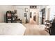 This bedroom offers neutral carpet, a bookcase and shelf combination and white trim at 795 Pickled Pepper Pl, Henderson, NV 89011