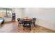 Dining area featuring a round wooden table with four black leather chairs at 795 Pickled Pepper Pl, Henderson, NV 89011