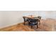 Cozy dining space showcasing a round table with four chairs and wood-look tile floors at 795 Pickled Pepper Pl, Henderson, NV 89011