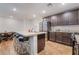 Spacious kitchen featuring an island, stainless steel appliances, light countertops and plenty of storage at 795 Pickled Pepper Pl, Henderson, NV 89011