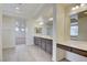 Bright bathroom with double vanity, makeup station, and ample storage at 9003 Greek Palace Ave, Las Vegas, NV 89178