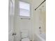 Clean bathroom featuring a toilet, shower, and a window for natural light at 9003 Greek Palace Ave, Las Vegas, NV 89178