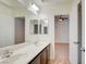 Well-lit bathroom featuring double sinks and a view into the adjoining room at 9003 Greek Palace Ave, Las Vegas, NV 89178