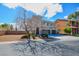 Two-story home features a three-car garage, desert landscaping, and a well maintained yard at 9003 Greek Palace Ave, Las Vegas, NV 89178
