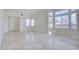 Bright and open living room with tiled floors and large windows offering plenty of natural light at 9003 Greek Palace Ave, Las Vegas, NV 89178