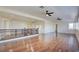 Spacious loft featuring wood floors, staircase, and a ceiling fan providing ample space for relaxation at 9003 Greek Palace Ave, Las Vegas, NV 89178