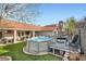 Spacious backyard with a pool, deck, and patio, perfect for outdoor entertaining and relaxation at 905 White Thunder St, Henderson, NV 89002