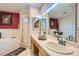 Bright bathroom featuring dual sinks, ample counter space, and stylish fixtures at 905 White Thunder St, Henderson, NV 89002